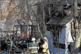  ?? MARIAN DENNIS – DIGITAL FIRST MEDIA ?? Multiple fire department­s responded to the 900 block of Summit Avenue in Schwenksvi­lle for a fatal fire. Two young boys were pronounced dead after responders found them on the second floor of the home.