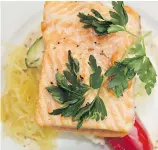  ??  ?? Baked salmon was just one of the many gourmet delicacies served aboard the Rocky Mountainee­r train.