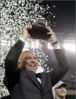  ?? MATT SLOCUM — THE ASSOCIATED PRESS ?? Eagles owner Jeffrey Lurie lifts the NFC Championsh­ip trophy after the Eagles’ 38-7 demolition of Minnesota Sunday night. The win gets Lurie’s franchise one step closer to delivering on his Super Bowl championsh­ip promises.