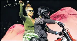  ?? AP PHOTO ?? Rihanna rides on a motorcycle after showing her fashion collection from Fenty Puma by Rihanna during Fashion Week Sunday.