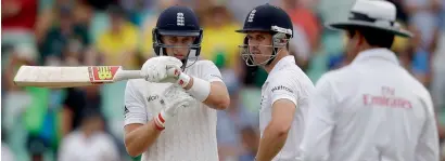  ?? AP file ?? England’s Joe Root (left), signals a review request to the umpire during a Test match against South Africa.