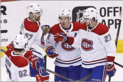  ?? The Associated Press ?? The Montreal Canadiens, seen here celebratin­g a goal in Thursday’s 5-2 road win over the Arizona Coyotes, are another team that could be busy between now and Monday afternoon. Captain Max Pacioretty, left, and Alex Galchenyuk, right, are two trade...