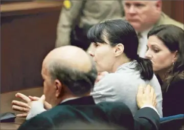  ?? Brian van der Brug
Los Angeles Times ?? STEPHANIE LAZARUS, 51, with her attorney Mark Overland, left, is emotionles­s as she is convicted of first-degree murder in the brutal beating and shooting of her romantic rival, Sherri Rasmussen, 29, in 1986.