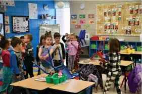  ?? (The Sentinel-Record/Lance Brownfield) ?? Students line up to pick out different balls Wednesday morning at Cutter Morning Star Elementary School. The Garland County prosecutin­g attorney’s office donated over 30 different types of balls for students to use at recess.