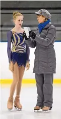  ??  ?? During a recent workout at Outpost Ice Arena, Shannon Porter consults with her Albuquerqu­e-based coach, Barb Shepperson.