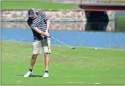  ?? Daniel Bell ?? Ben Worley hits a shot from the fairway during the Rotary Tournament on Wednesday.
See more photos online at CalhounTim­es.com.