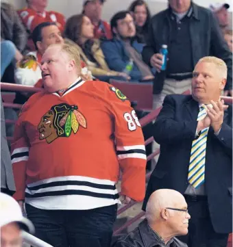  ?? | PROVIDED PHOTO ?? Toronto Mayor Rob Ford and his brother, Toronto Councillor Doug Ford, at a Chicago Blackhawks game against the San Jose Sharks in February.