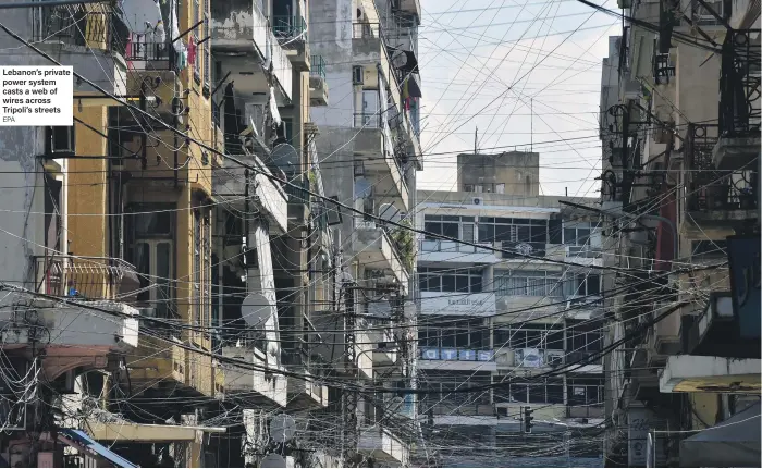  ?? EPA ?? Lebanon’s private power system casts a web of wires across Tripoli’s streets