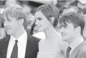  ?? IAN GAVAN/GETTY 2011 ?? Rupert Grint, from left, Emma Watson and Daniel Radcliffe appear in the HBO Max reunion special “Harry Potter 20th Anniversar­y: Return to Hogwarts.”