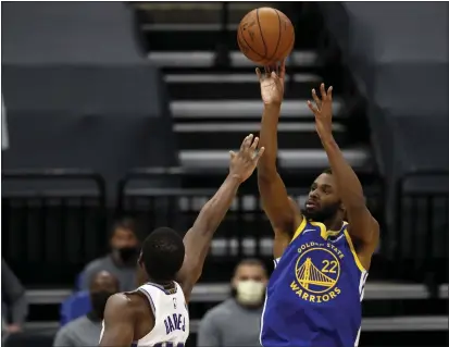  ?? NHAT V. MEYER — BAY AREA NEWS GROUP ?? The Warriors’ Andrew Wiggins (22) takes a shot against the Kings’ Harrison Barnes in the first quarter at Golden 1 Center on Thursday.