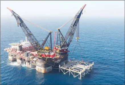  ??  ?? This file photo shows an oil platform in the Leviathan natural gas field, in the Mediterran­ean Sea off the Israeli coast. Israel became a major energy exporter for the first time on Dec 16, 2019, after signing a permit to export natural gas to neighborin­g Egypt. The announceme­nt comes just days before
a lucrative Israeli gas field in the Mediterran­ean Sea is expected to go online. (AP)