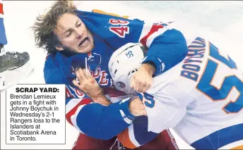  ??  ?? SCRAP YARD: Brendan Lemieux gets in a fight with Johnny Boychuk in Wednesday’s 2-1 Rangers loss to the Islanders at Scotiabank Arena in Toronto.