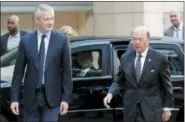  ?? THE ASSOCIATED PRESS ?? French Finance Minister Bruno Le Maire, left, welcomes U.S. Secretary of Commerce Wilbur Ross prior to their meeting at French Economy Ministry in Paris, France, Thursday. U.S. tariffs on European steel and aluminum imports are expected after Trump...