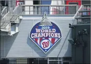  ?? NICK WASS — THE ASSOCIATED PRESS ?? A 2019 World Series champions sign is displayed during the Washington Nationals baseball practice at Nationals Park, July 22, in Washington.