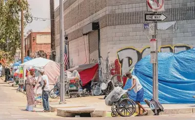  ?? Damian Dovarganes/Associated Press ?? Los Angeles County has a higher rate of people living on the streets than the Bay Area, data shows.