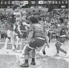  ?? JOVANNY HERNANDEZ / MILWAUKEE JOURNAL SENTINEL ?? Wisconsin Lutheran celebrates its victory over Nicolet in the WIAA Division 2 boys state semifinal game on Friday at the Kohl Center in Madison.