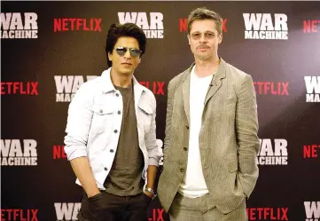  ??  ?? Superstars Shah Rukh Khan and Brad Pitt pose for a photograph during the Indian premiere of forthcomin­g Netflix film ‘War Machine’ in Mumbai. — AFP photo courtesy of Netflix