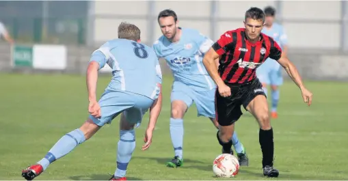  ??  ?? ● Port’s Jamie McDaid outwits the Holywell defence. Pic: Richard Birch