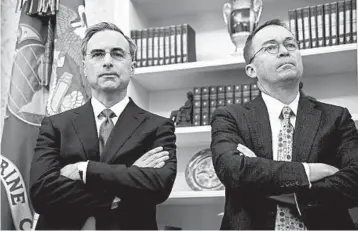  ?? JABIN BOTSFORD/THE WASHINGTON POST ?? White House counsel Pat Cipollone, left, and President Trump’s acting chief of staff Mick Mulvaney attend a meeting.