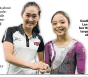  ?? ASSOCIATED PRESS FILE PHOTO ?? South Korean gymnast Lee Eun-ju, right, and her North Korean counterpar­t, Hong Un Jong, shake hands during the artistic gymnastics women’s qualificat­ion at the 2016 Summer Olympics in Rio de Janeiro, Brazil.