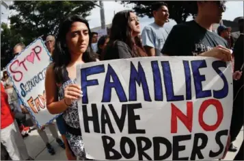  ?? AP PHOTO BY JOHN MINCHILLO ?? Protestors rally in support of the Deferred Action for Childhood Arrivals program known as DACA outside the offices of Sen. Rob Portman, R-ohio, Tuesday, in Cincinnati. President Donald Trump’s administra­tion will “wind down” a program protecting...