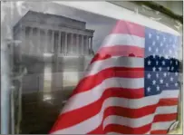  ?? Washington Post photo by Matt McClain ?? The Lincoln Memorial is reflected in a window of a structure near the memorial in Washington. The annual Memorial Day Parade was canceled. So was the concert on the West Lawn of the Capitol. And the Rolling to Remember motorcycle rally, too.