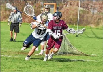  ?? BARRY TAGLIEBER — FOR DIGITAL FIRST MEDIA ?? Garnet Valley’s Jake Morin (15) looks for a cutter while being defended by Spring-Ford’s Dean Costalas during a game between the teams at the Katie Samson Festival at Radnor Saturday.