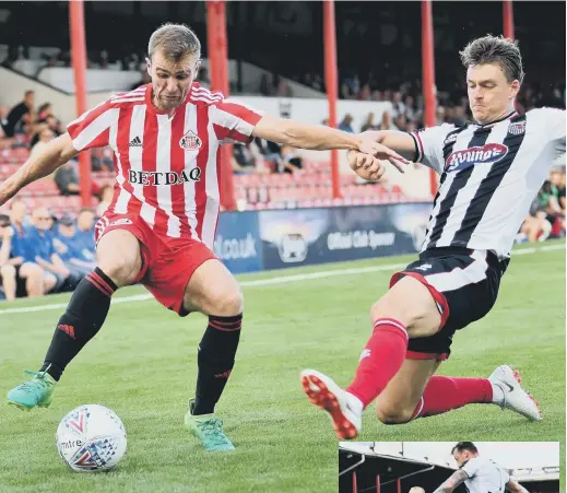 ??  ?? Winger Callum McManaman in control at Grimsby. Pictures by Frank Reid.