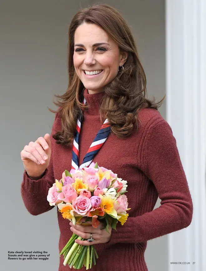  ??  ?? Kate clearly loved visiting the Scouts and was give a posey of flowers to go with her woggle