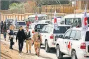  ?? REUTERS ?? Internatio­nal Committee of the Red Cross convoy seen crossing into eastern Ghouta near Wafideen camp in Damascus.