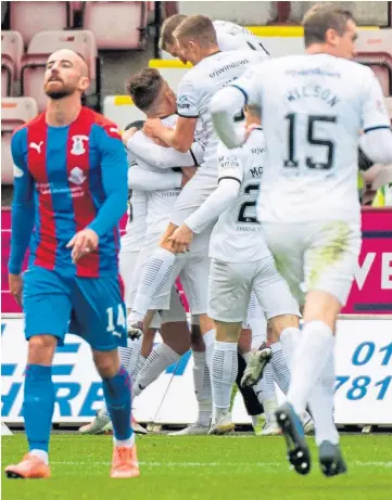  ??  ?? LEVELLER: Dunfermlin­e players celebrate after Ryan Dow grabs the equaliser.