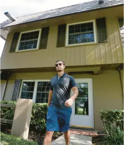  ?? JOE BURBANK/ORLANDO SENTINEL ?? Garret Fields in front of his College Park townhouse on Thursday.