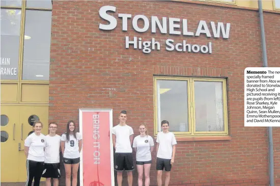  ??  ?? Memento The new specially framed banner from Atos was donated to Stonelaw High School and pictured receiving it are pupils (from left) Rose Sharkey, Kyle Johnson, Megan Quinn, Sean Mullen, Emma Wotherspoo­n and David McKenna