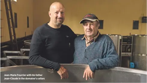  ??  ?? Jean-Marie Fourrier with his father Jean-Claude in the domaine’s cellars