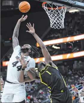  ?? Ellen Schmidt Las Vegas Review-journal @ellenschmi­dttt ?? Colorado center Eddie Lampkin Jr., left, and Oregon center N’faly Dante battle for a rebound Saturday at T-mobile Arena.