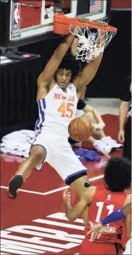  ?? Ethan Miller / Getty Images ?? Jericho Sims of the New York Knicks dunks against the Toronto Raptors during the NBA Summer League at the Thomas & Mack Center on Aug. 8 in Las Vegas. The Raptors defeated the Knicks 89-79.