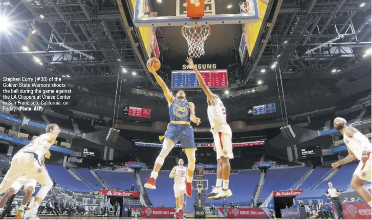  ?? (Photo: AFP) ?? Stephen Curry (#30) of the Golden State Warriors shoots the ball during the game against the LA Clippers at Chase Center in San Francisco, California, on Friday.