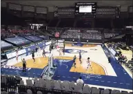  ?? David Butler II / Associated Press ?? The UConn Huskies take on the Xavier Musketeers to an almost empty Harry A. Gampel Pavilion in the second half in Storrs on Dec. 19. UConn defeated Xavier 106-59. The UConn athletic budget deficit increased to $43.5 million.