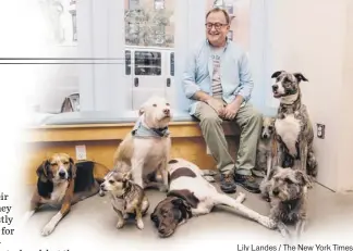  ?? Lily Landes / The New York Times ?? Ken Foster and friends at the dog-friendly Boris &amp; Horton cafe in Manhattan. Foster wanted to set the record straight about what life is like for four-legged New Yorkers.