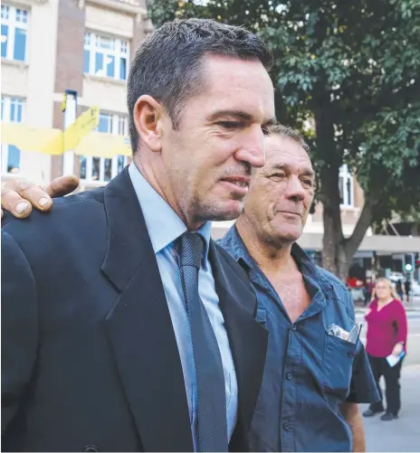  ?? Main pictures: AAP IMAGE ?? Soldier Christophe­r Carter leaves the Brisbane Supreme Court with his father by his side. Mr Carter was acquitted of murdering his exwife Renee Carter and her boyfriend Corey Croft.