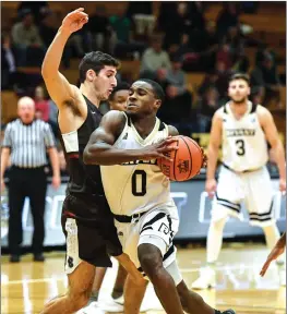  ?? Photo by Jerry Silberman | risportsph­oto.com ?? Bryant sophomore guard Ikenna Ndugba (0) looks to drive during Sunday’s game against Brown at the Chace Athletic Center. The Bulldogs still have to play games at Yale, Louisville, and Memphis before the start of conference play.