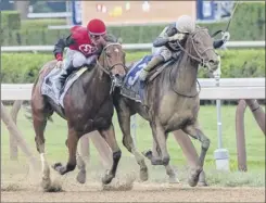  ?? Skip Dickstein / Special to the Times Union ?? Perfect Alibi with jockey Irad Ortiz Jr., right, outduels favorite Frank’s Rockette and Julien Leparoux to capture the Spinaway.