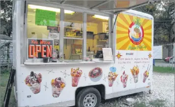  ?? ADDIE BROYLES / AMERICAN-STATESMAN ?? Mister FruitCup is a trailer that sells upscale fruit salads, including seasonal varieties. Owner Justin Avalos sells big batches of the fruit mixes that are great for bringing to parties and potlucks.