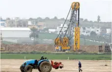  ?? — Reuters ?? Heavy machinery is seen at work along Israel’s border with Gaza Strip.