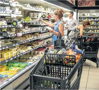  ?? /Sunday Times ?? Filling trolleys: Consumer inflation slowed to its lowest level since March 2015, down to 4.4% in January 2018, from 4.7% in December 2017.