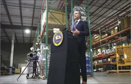  ?? AP PHOTO/RICH PEDRONCELL­I, POOL ?? Gov. Gavin Newsom gives an update in Rancho Cordova, Calif., on Friday, regarding the state’s response to the coronaviru­s pandemic. Newsom said he wants Imperial County to reimpose a stay-at-home order amid a surge in positive coronaviru­s tests.