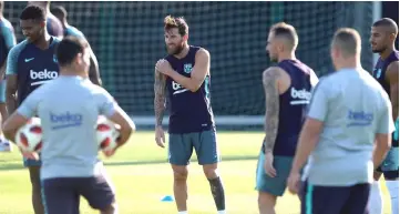  ??  ?? Messi (centre) takes part in a training session at the FC Barcelona ‘Joan Gamper’ sports centre in Sant Joan Despi near Barcelona. — AFP photo