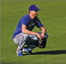  ?? Associated Press ?? Return for deGrom pushed back: Texas Rangers pitcher Jacob deGrom works out prior to a baseball game against the Baltimore Orioles last month in Baltimore.