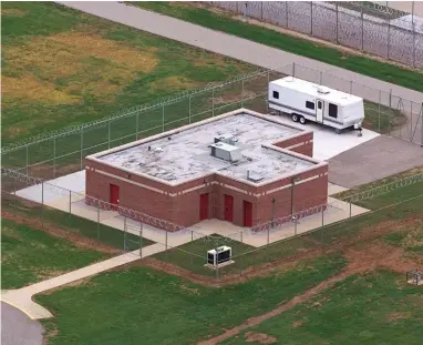  ?? AP file Photo by Michael Conroy ?? In this June 11, 2001 file photo, an aerial view of the execution facility at the United States Penitentia­ry in Terre Haute, Ind., is shown. After the latest 17-year hiatus, the Trump administra­tion wants to restart federal executions this month at the Terre Haute, prison. Four men are slated to die. All are accused of murdering children in cases out of Arkansas, Kansas Iowa and Missouri.