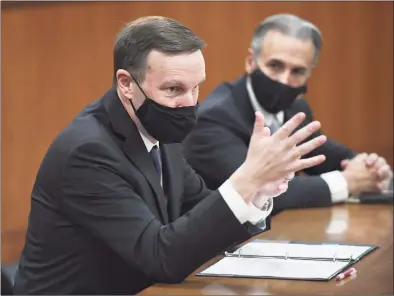  ?? Tyler Sizemore / Hearst Connecticu­t Media ?? Sen. Chris Murphy, D-Conn., left, and Greenwich First Selectman Fred Camillo speak at a roundtable discussion regarding transporta­tion and infrastruc­ture needs at Town Hall in Greenwich on Monday.